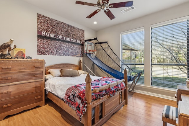 bedroom featuring hardwood / wood-style floors and ceiling fan