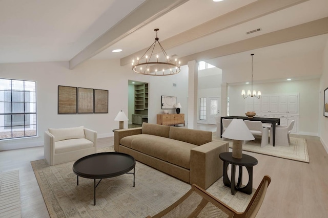 living room featuring a chandelier, light wood-type flooring, lofted ceiling with beams, and decorative columns