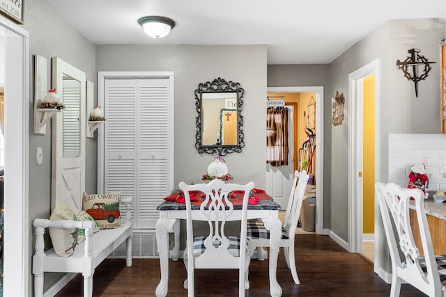 dining area featuring dark hardwood / wood-style floors