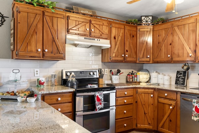 kitchen with decorative backsplash, appliances with stainless steel finishes, and light stone counters