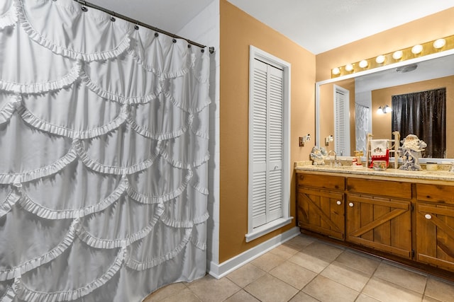 bathroom featuring tile patterned floors and vanity