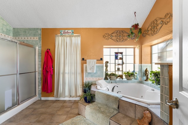 bathroom featuring a textured ceiling, lofted ceiling, and shower with separate bathtub