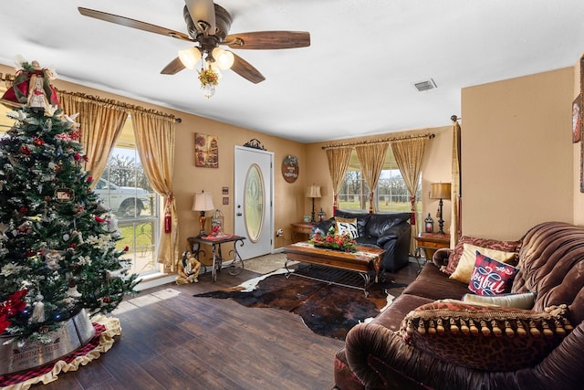 living room featuring hardwood / wood-style flooring and ceiling fan