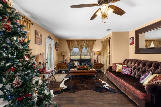 living room with ceiling fan and wood-type flooring