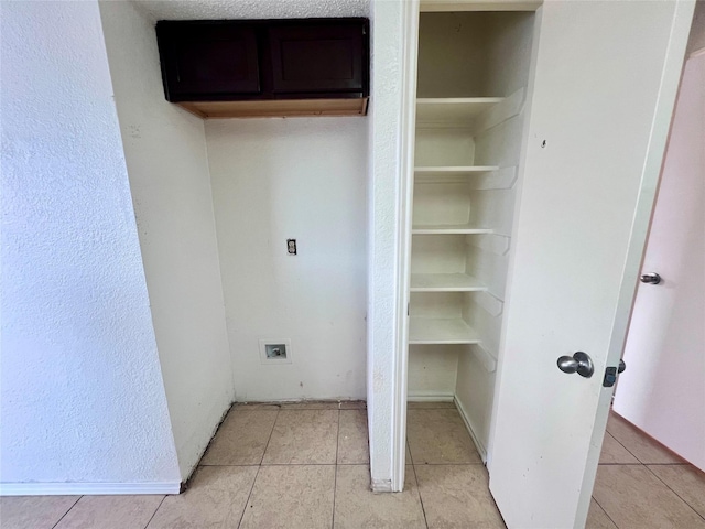 washroom with light tile patterned flooring