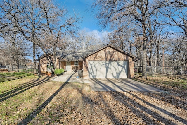 view of front of home with a front lawn and a garage