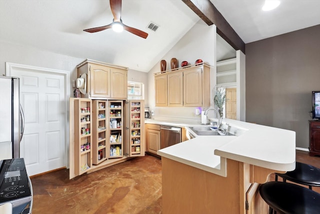 kitchen featuring sink, stainless steel appliances, lofted ceiling with beams, kitchen peninsula, and light brown cabinetry