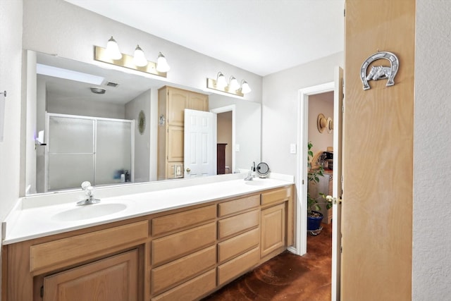 bathroom featuring vanity and a shower with door