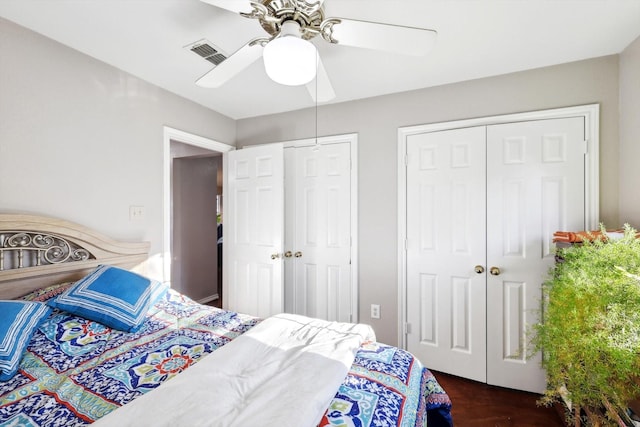 bedroom featuring ceiling fan and dark hardwood / wood-style floors