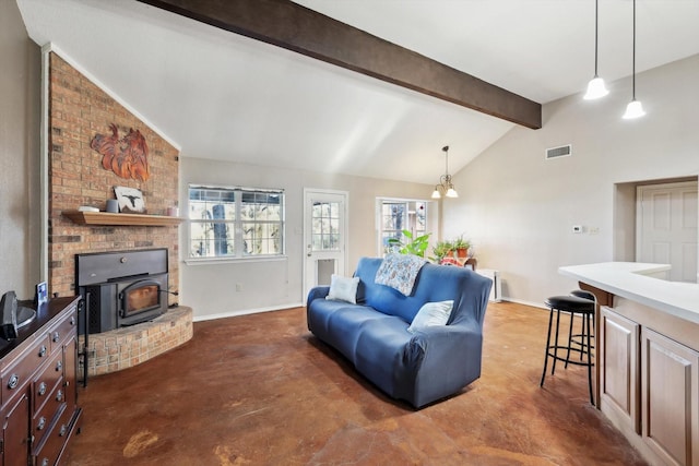 living room with beam ceiling, high vaulted ceiling, an inviting chandelier, and a wood stove