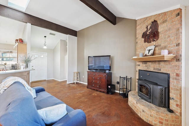 living room with lofted ceiling with beams