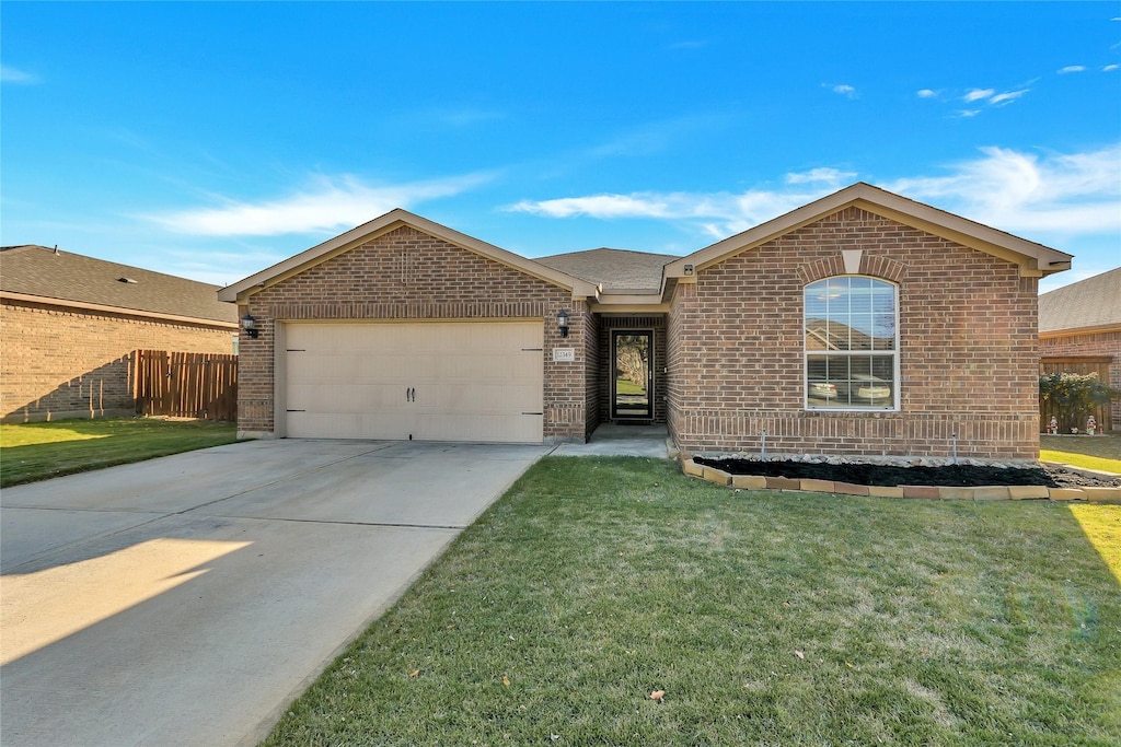 ranch-style house with a garage and a front lawn