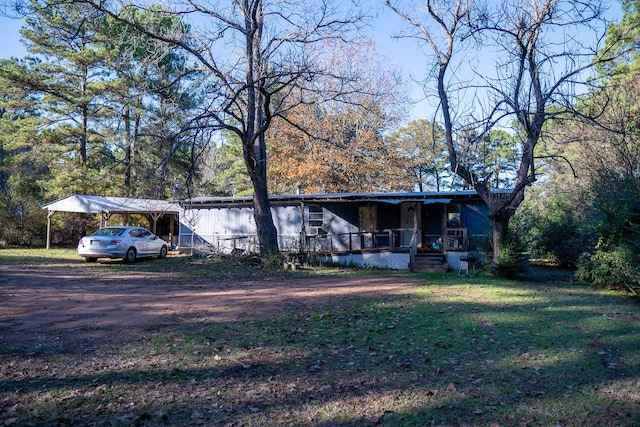 view of front of house featuring a porch and a carport