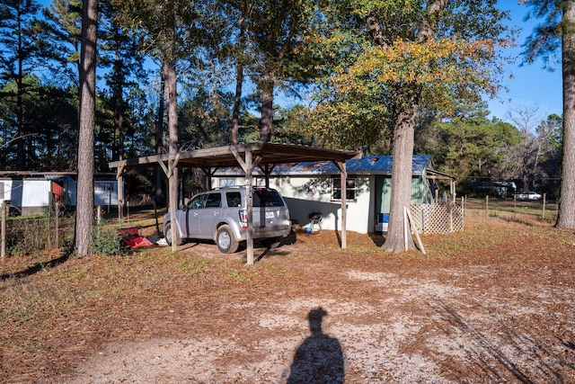 exterior space with a carport