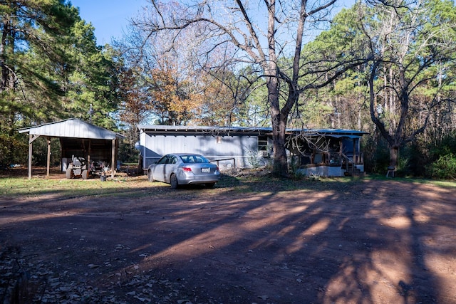 view of front of home with a carport