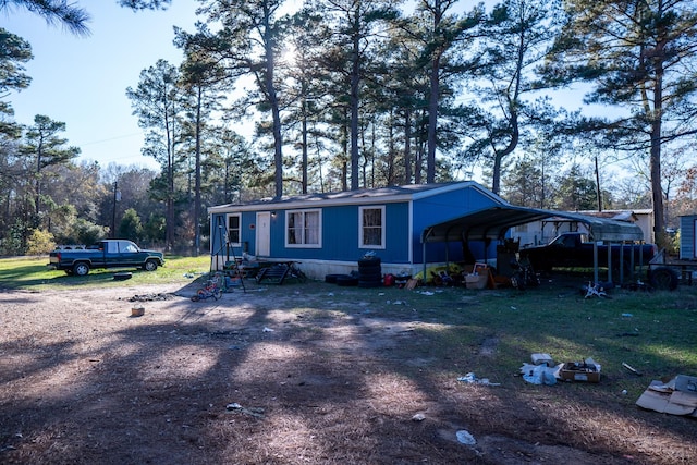 view of front facade with a carport