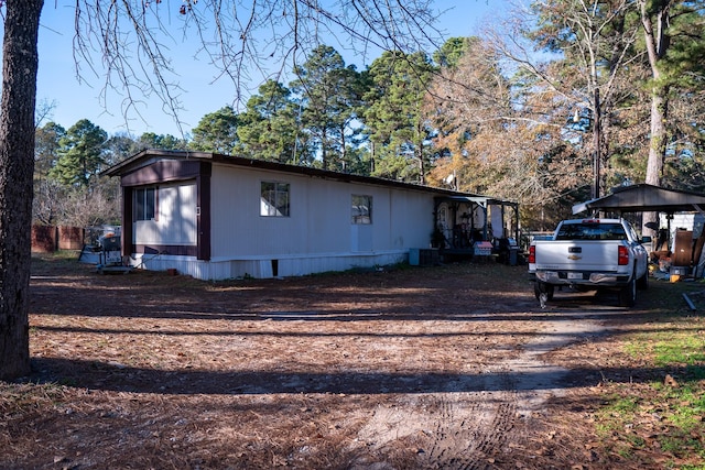 view of side of home featuring central air condition unit