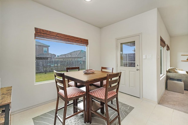 dining area with light tile patterned floors