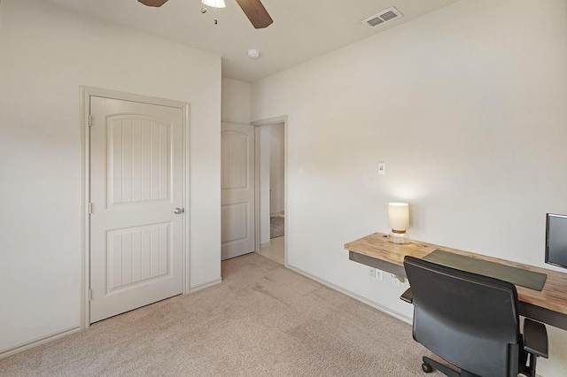 carpeted office with ceiling fan