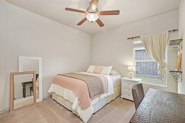 bedroom featuring light carpet and ceiling fan