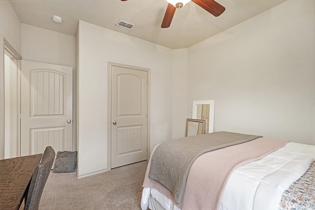 bedroom featuring ceiling fan and light colored carpet