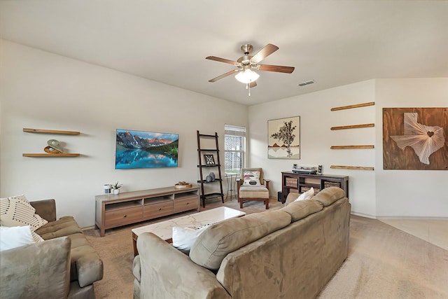 living room featuring ceiling fan and light carpet