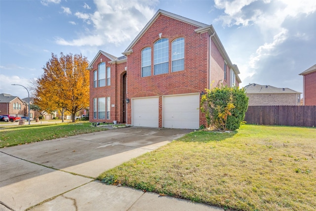 view of front property featuring a garage and a front lawn