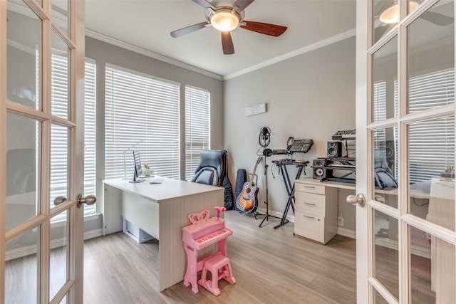 home office with ceiling fan, french doors, light hardwood / wood-style floors, and ornamental molding