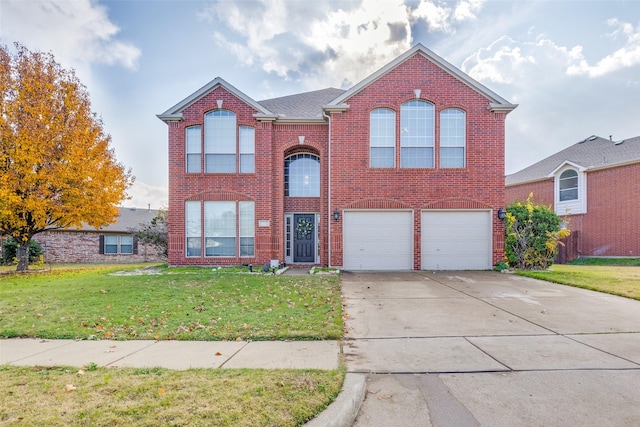 front facade featuring a garage and a front yard