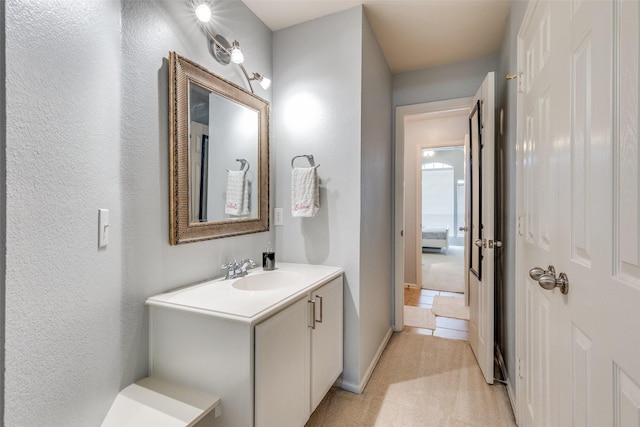2712 Thorncreek Ln, Fort Worth, TX 76177 - bathroom with vanity and a textured wall