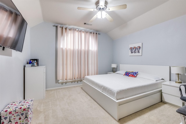 carpeted bedroom with ceiling fan and lofted ceiling