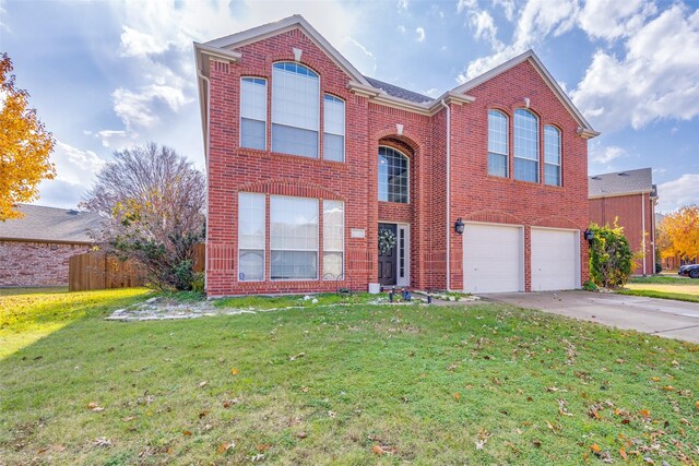 view of front of house featuring a front lawn and a garage