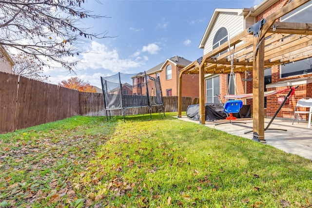 2712 Thorncreek Ln, Fort Worth, TX 76177 - fenced backyard with a trampoline, a pergola, and a patio area