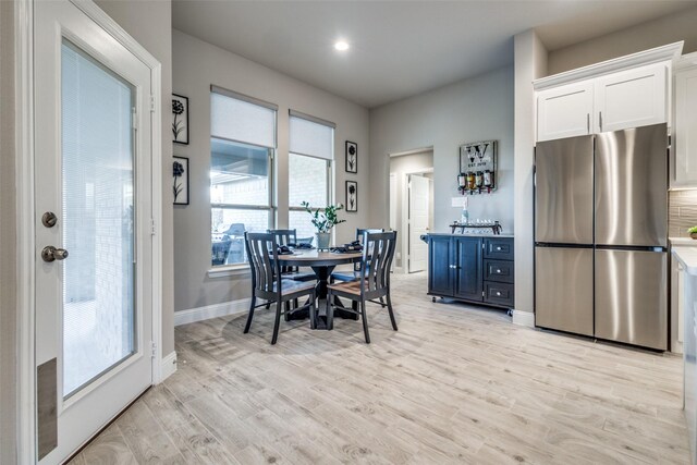 dining space featuring light hardwood / wood-style flooring