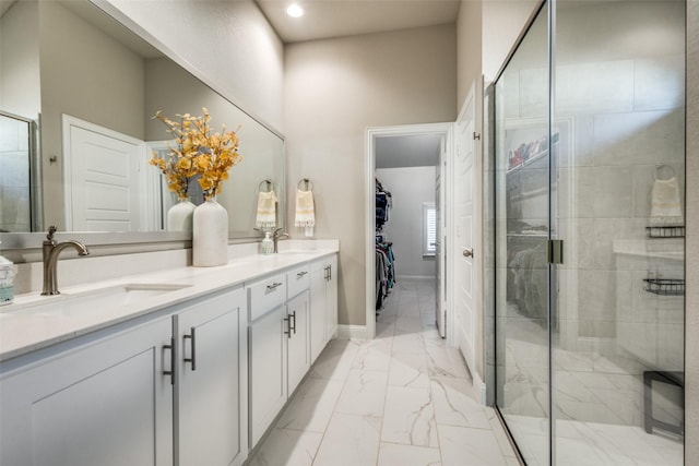 bathroom with vanity and a shower with shower door