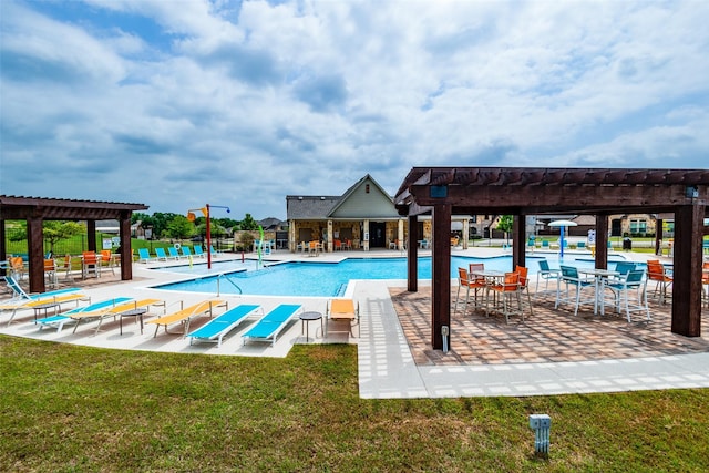 view of swimming pool with a pergola, a patio area, and a yard