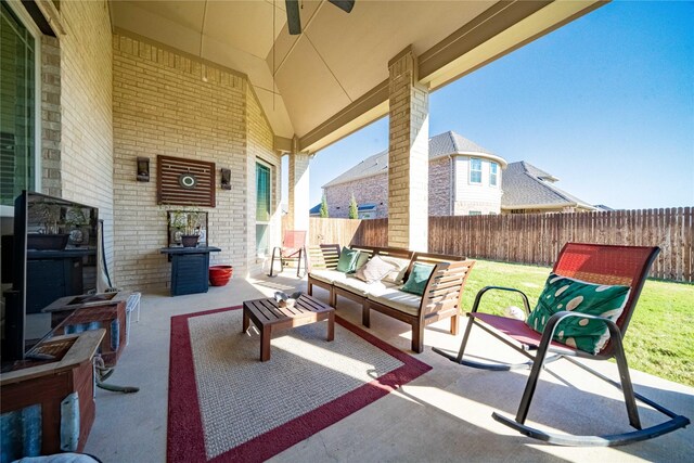 view of patio / terrace with an outdoor living space and a fenced backyard