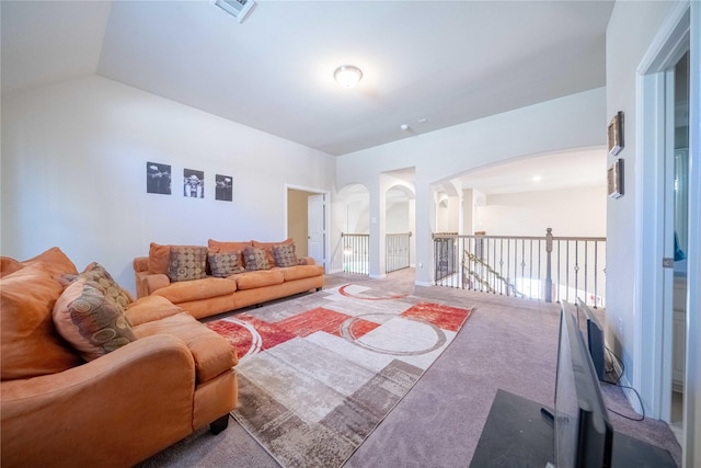 living room featuring carpet and lofted ceiling