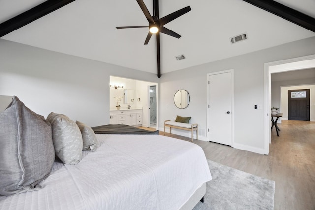 bedroom featuring high vaulted ceiling, ensuite bathroom, ceiling fan, beam ceiling, and light hardwood / wood-style floors