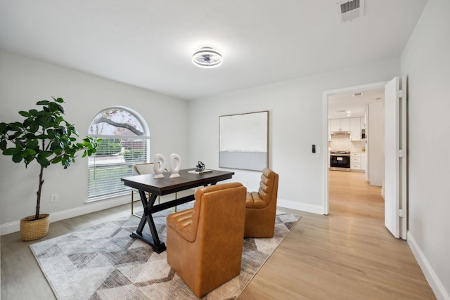 dining room with light hardwood / wood-style floors