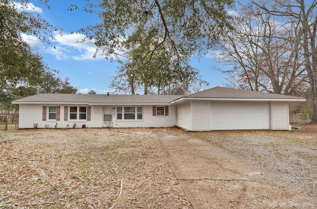 ranch-style home featuring a garage