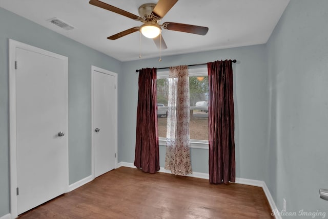 6263 Bain Blvd, Keithville, LA 71047 - empty room with baseboards, a ceiling fan, wood finished floors, and visible vents