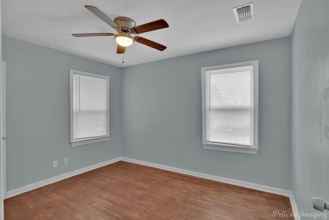 spare room with ceiling fan and light hardwood / wood-style floors