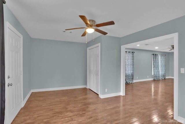 6263 Bain Blvd, Keithville, LA 71047 - unfurnished room featuring baseboards, ceiling fan, wood finished floors, and visible vents