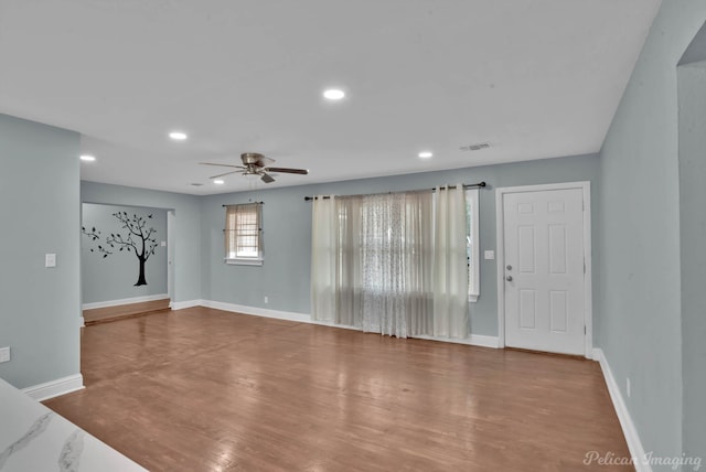 6263 Bain Blvd, Keithville, LA 71047 - unfurnished living room with ceiling fan, recessed lighting, baseboards, wood finished floors, and visible vents