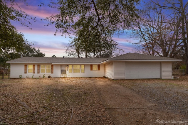 ranch-style house featuring a garage