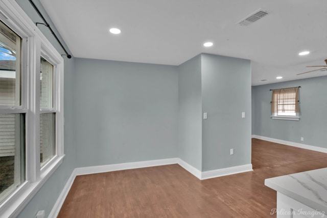 empty room featuring hardwood / wood-style floors and ceiling fan