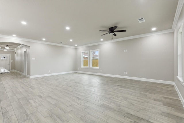 spare room featuring ceiling fan, crown molding, and light hardwood / wood-style flooring