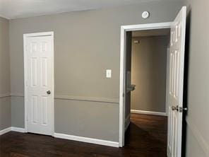 interior space with dark wood-type flooring