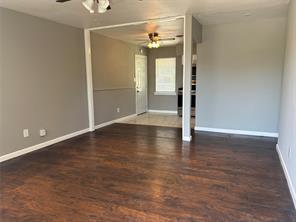 spare room featuring dark hardwood / wood-style floors and ceiling fan